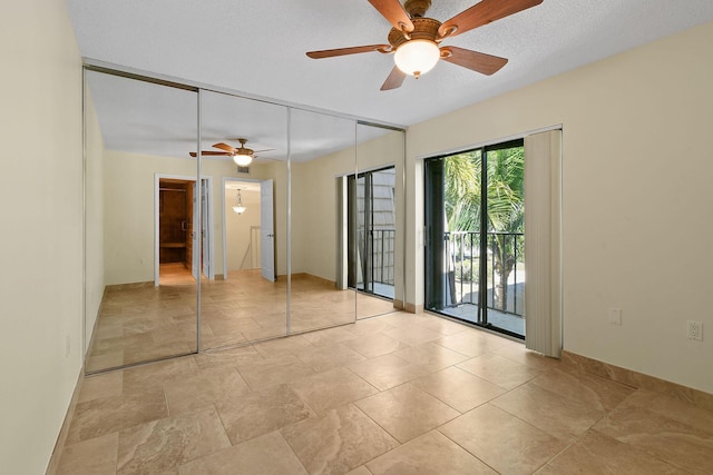 unfurnished bedroom featuring a textured ceiling, access to exterior, ceiling fan, and a closet