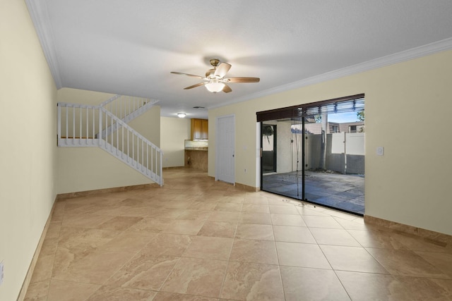 unfurnished room with crown molding and ceiling fan