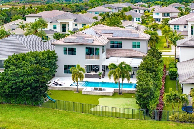 view of pool featuring a lawn and a patio area