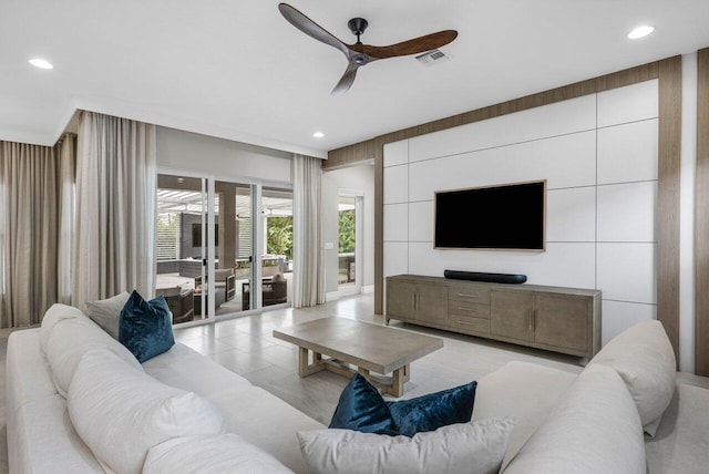 tiled living room featuring ceiling fan