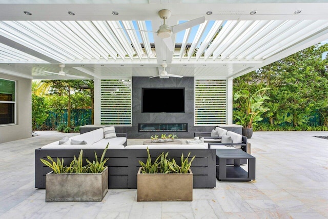 view of patio / terrace with ceiling fan, an outdoor living space with a fireplace, and a pergola