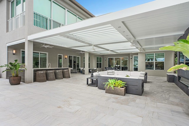 view of patio / terrace featuring an outdoor living space and ceiling fan