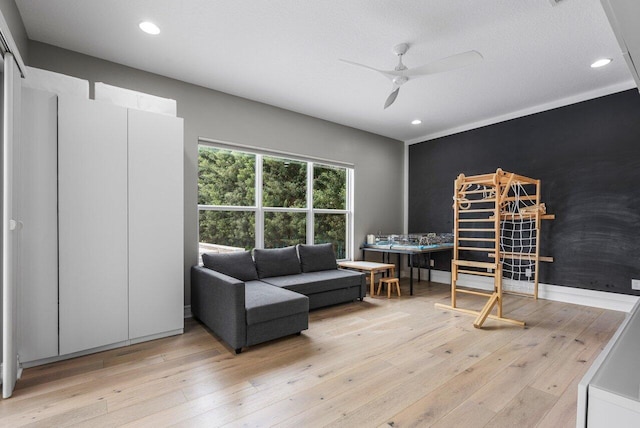 interior space with ceiling fan and light hardwood / wood-style floors