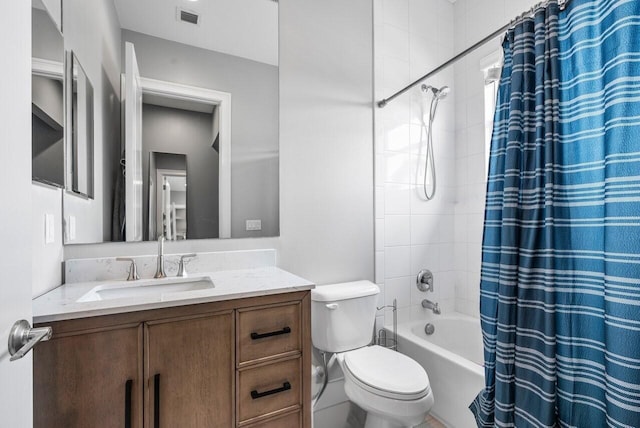 full bathroom featuring toilet, vanity, and shower / bathtub combination with curtain