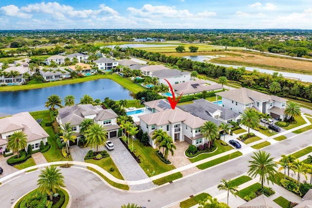 birds eye view of property featuring a water view