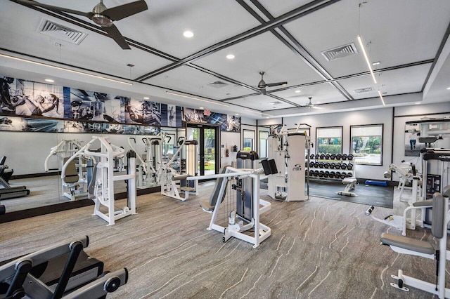 gym featuring ceiling fan, a healthy amount of sunlight, coffered ceiling, and carpet