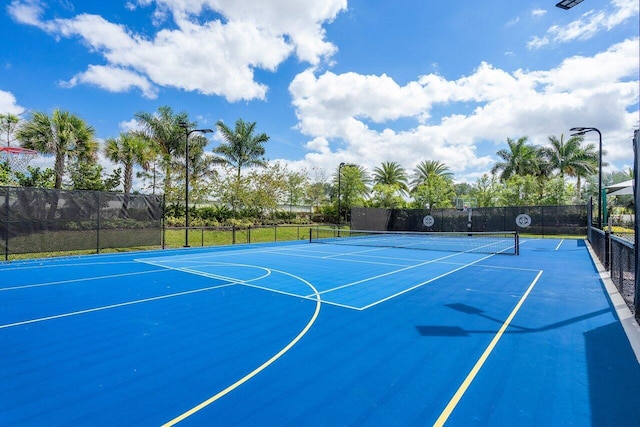 view of basketball court featuring tennis court