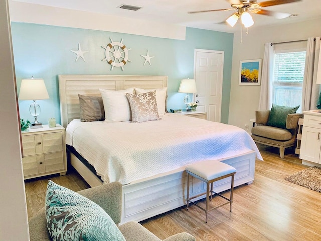 bedroom featuring ceiling fan and light hardwood / wood-style floors