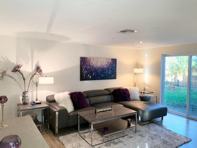 living room with light hardwood / wood-style flooring