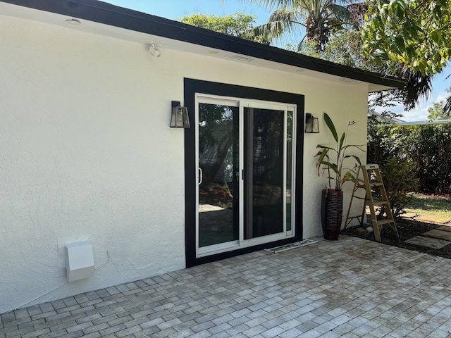 view of side of home with a patio area