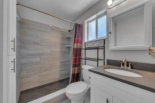 bathroom featuring a shower with curtain, vanity, and toilet