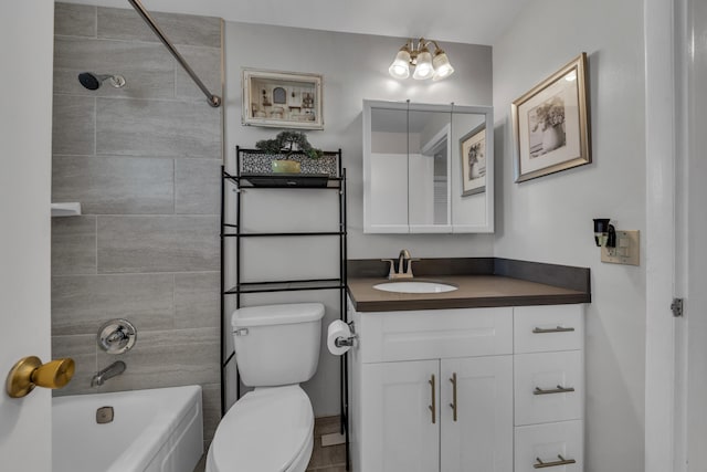 full bathroom with vanity, toilet, and tiled shower / bath combo