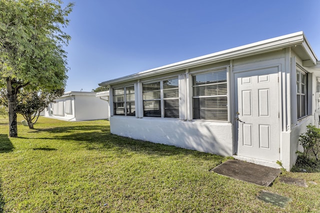 exterior space with a yard