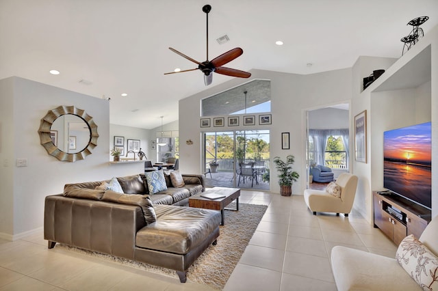 living room with high vaulted ceiling, ceiling fan, and light tile patterned flooring