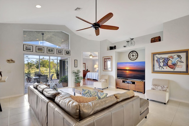 living room with light tile patterned flooring, ceiling fan, and high vaulted ceiling