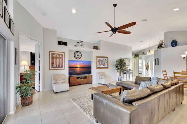 tiled living room featuring ceiling fan and lofted ceiling