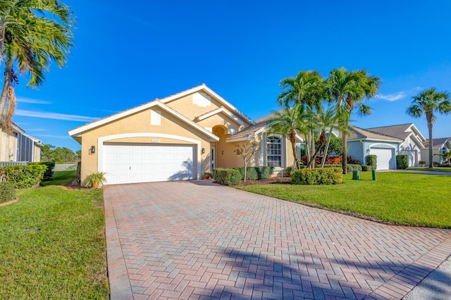 view of front of home featuring a garage and a front yard