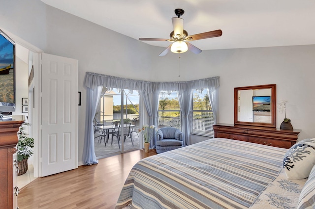 bedroom featuring ceiling fan, lofted ceiling, access to exterior, and light hardwood / wood-style flooring