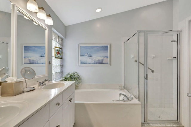 bathroom with lofted ceiling, independent shower and bath, and vanity