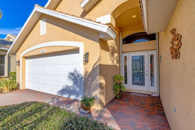 property entrance with a garage