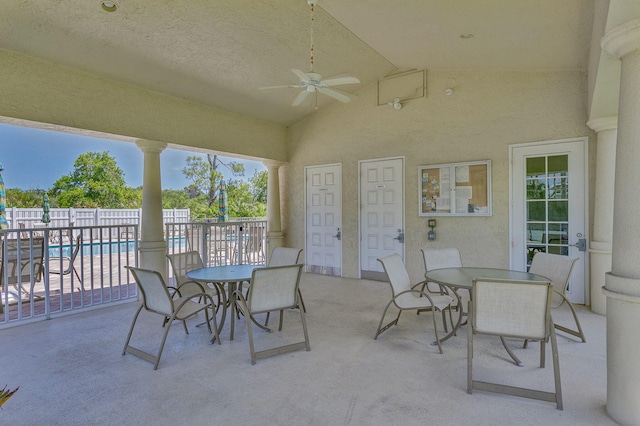 view of patio / terrace with a fenced in pool and ceiling fan