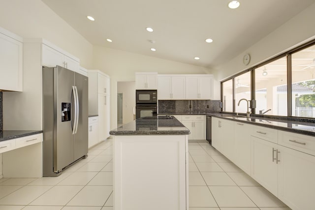 kitchen with white cabinets, a center island, light tile patterned floors, and black appliances