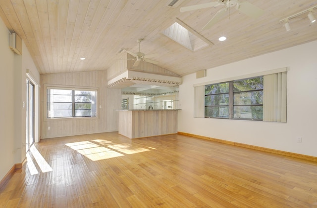 unfurnished living room with ceiling fan, vaulted ceiling with skylight, wooden ceiling, and light wood-type flooring