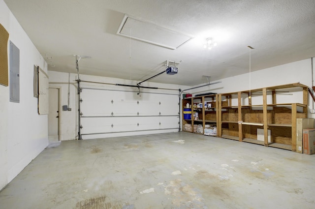 garage with a garage door opener and electric panel