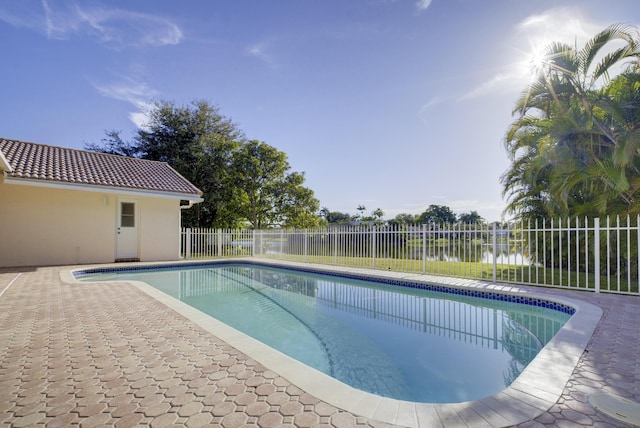 view of pool with a water view