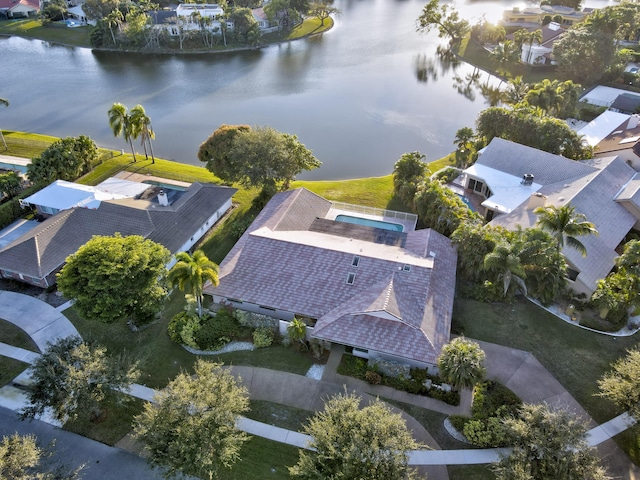 birds eye view of property with a water view