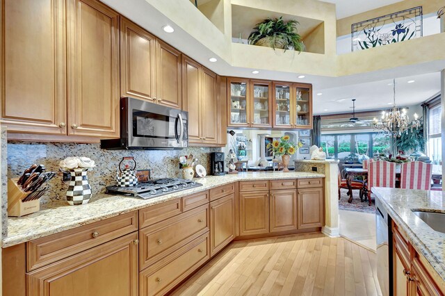 tiled dining space with ceiling fan