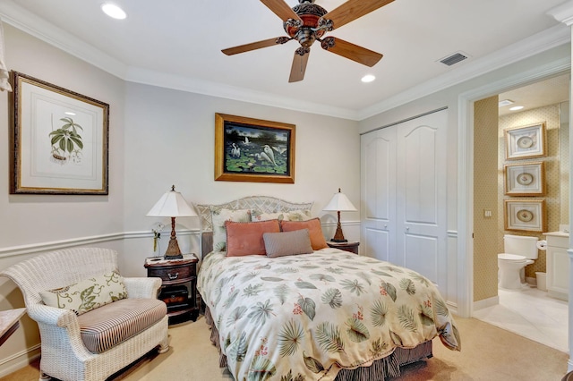 bedroom with ceiling fan, ornamental molding, ensuite bathroom, and a closet