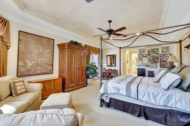 bedroom featuring ceiling fan, ornamental molding, carpet flooring, and a textured ceiling