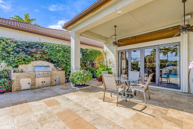 view of patio featuring area for grilling and exterior kitchen