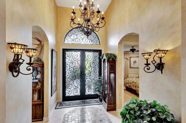 kitchen featuring appliances with stainless steel finishes, pendant lighting, sink, backsplash, and a kitchen island with sink