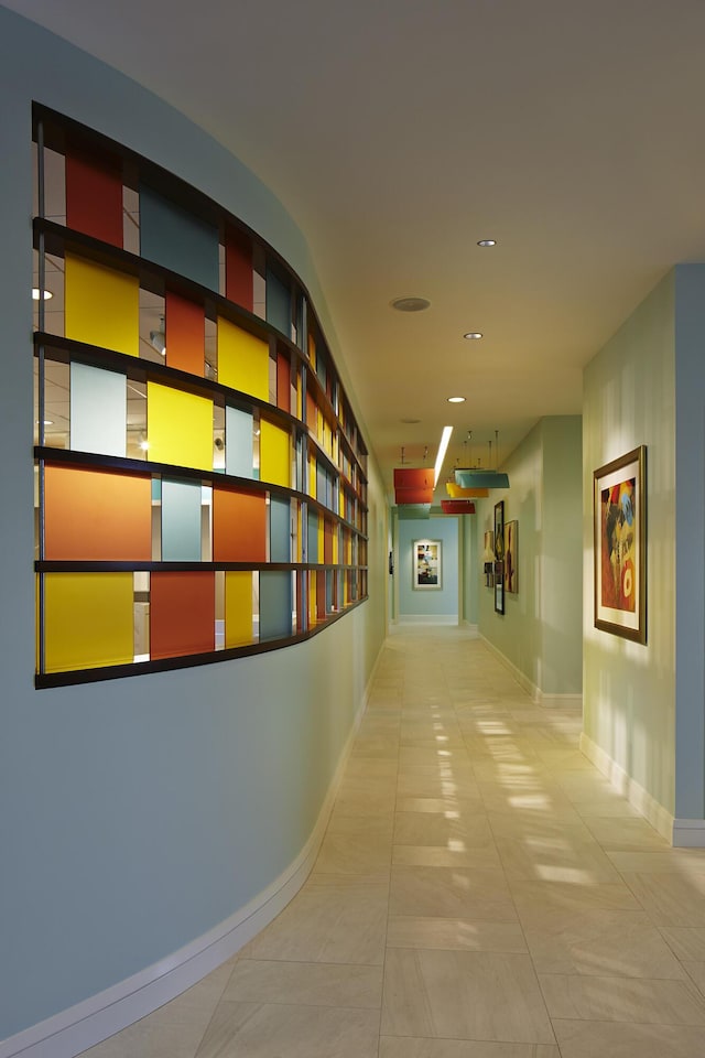 corridor featuring light tile patterned flooring