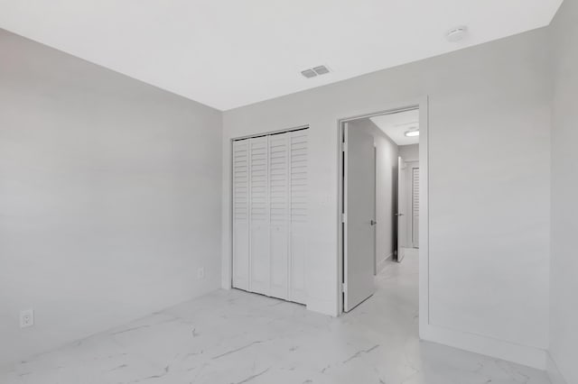 unfurnished bedroom featuring a closet