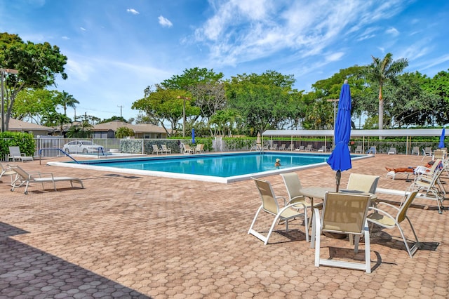 view of swimming pool featuring a patio area