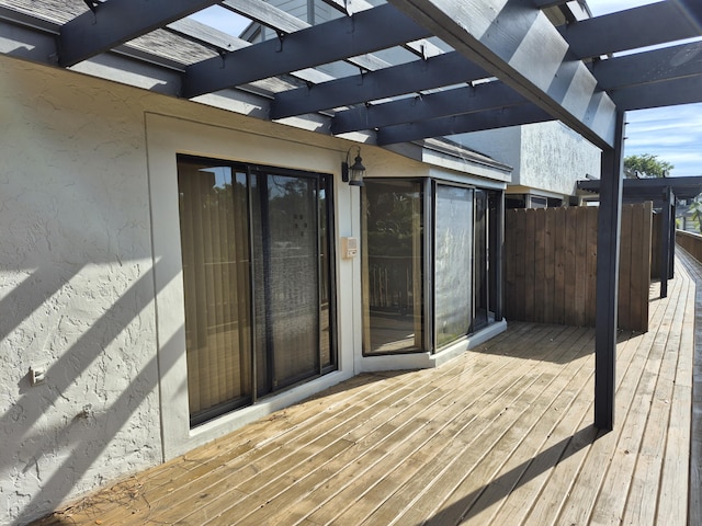 wooden deck featuring a pergola