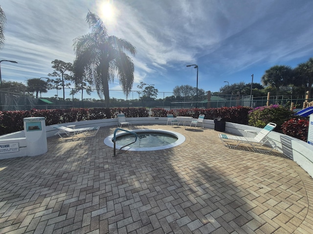 view of patio / terrace featuring a community hot tub