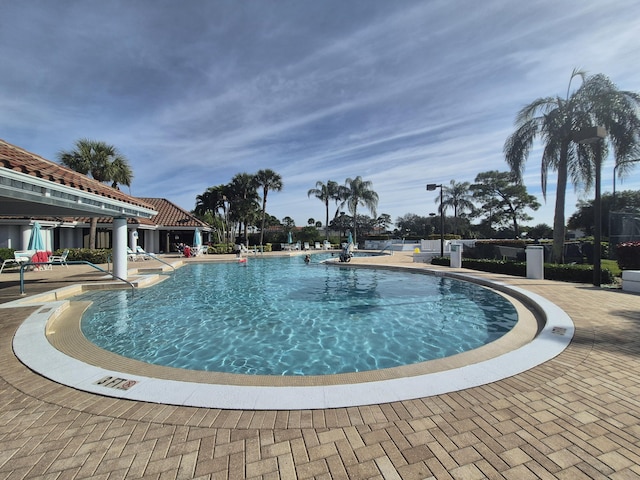 view of swimming pool featuring a patio