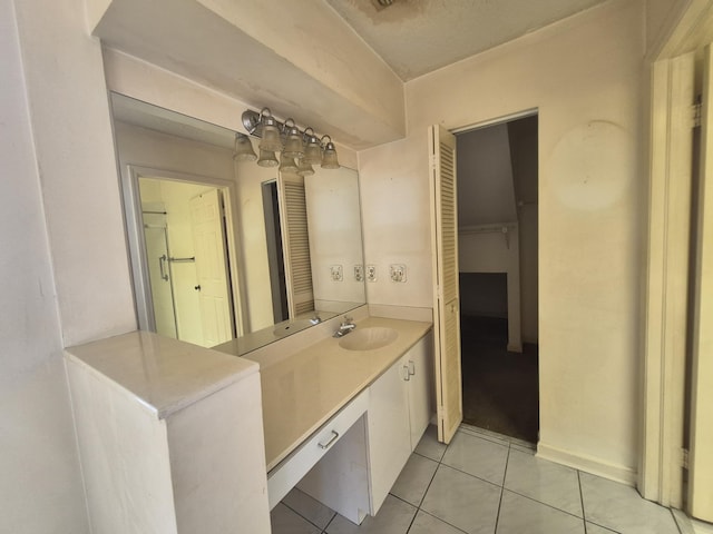 bathroom with tile patterned flooring and vanity