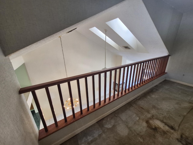 additional living space with carpet floors and vaulted ceiling with skylight