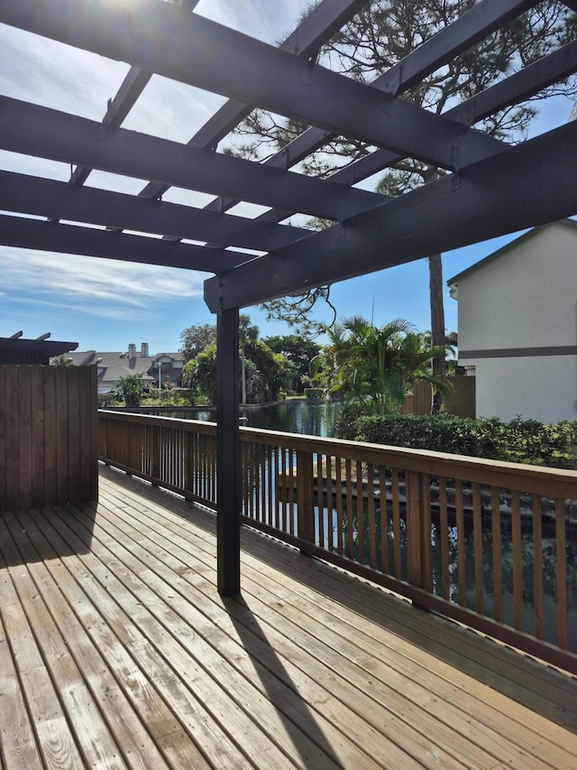 wooden deck with a water view