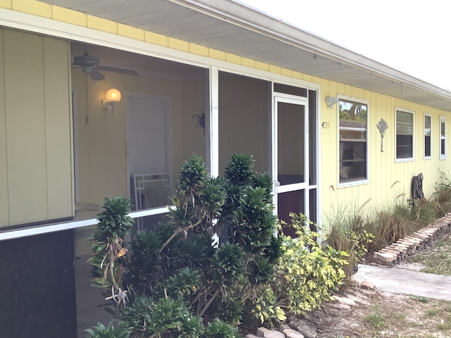 view of side of property with a sunroom