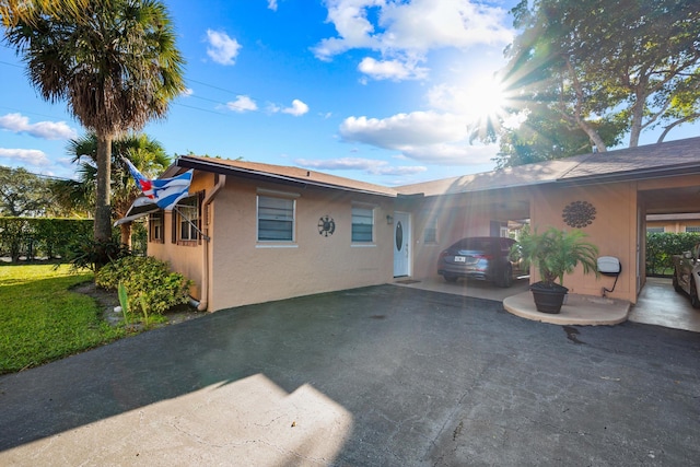 exterior space featuring a carport