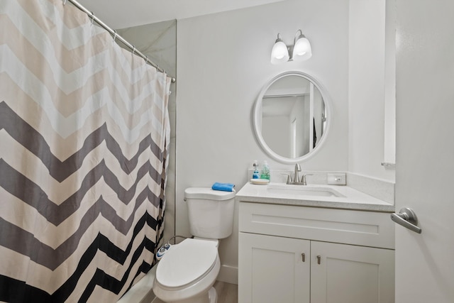 bathroom with vanity, a shower with curtain, and toilet