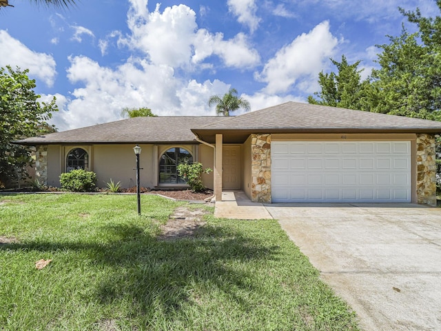 ranch-style house featuring a garage and a front lawn