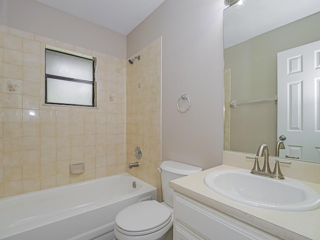 full bathroom with vanity, toilet, and tiled shower / bath combo