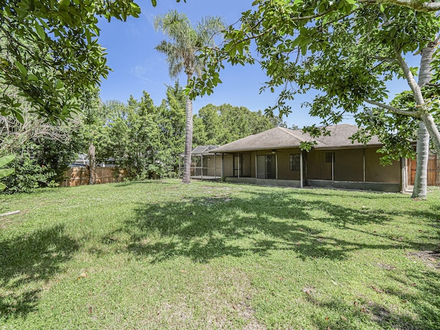 view of yard with a sunroom